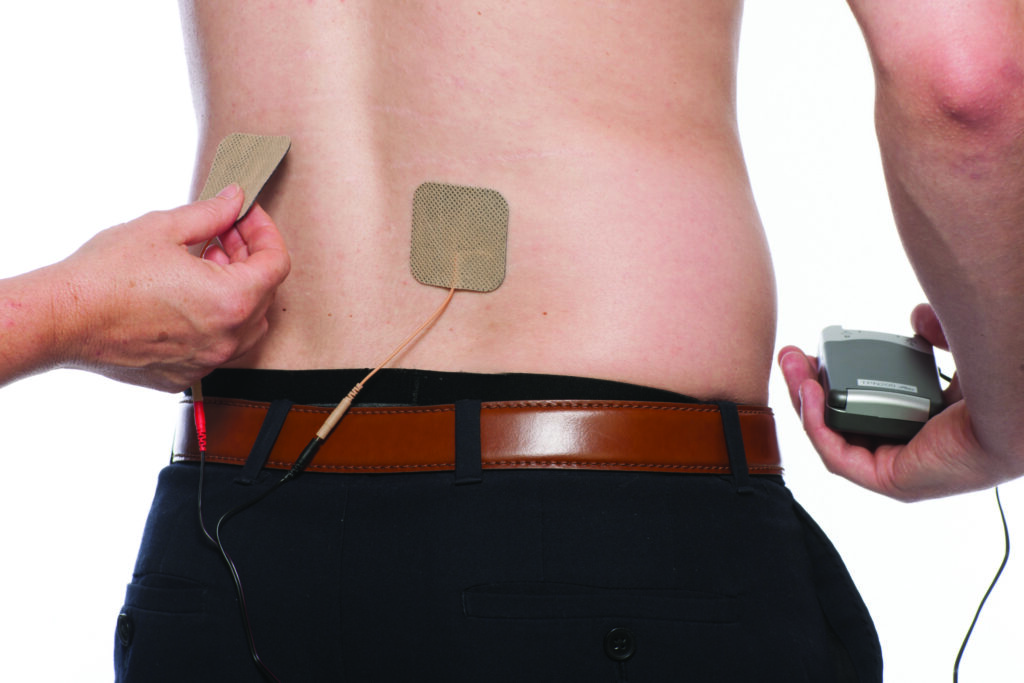 Picture 6 - photograph of a second pad being placed on a persons back