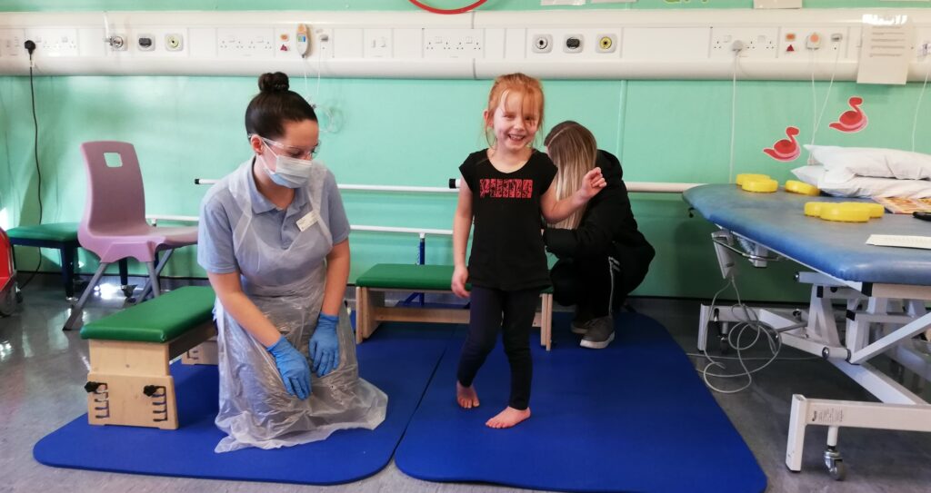 child and nurse in physiotherapy