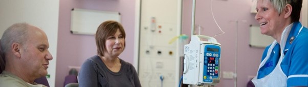 patients in hospital speaking to a nurse