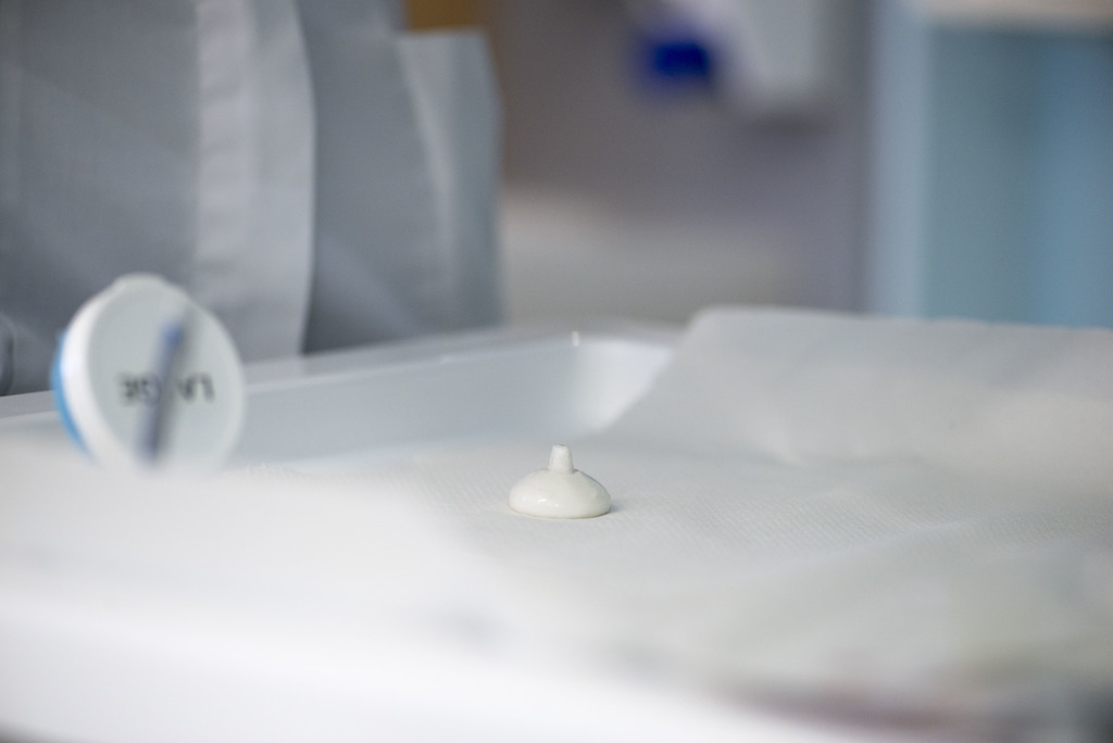 Photograph of an eye shield resting on surface, see next photo for scale.