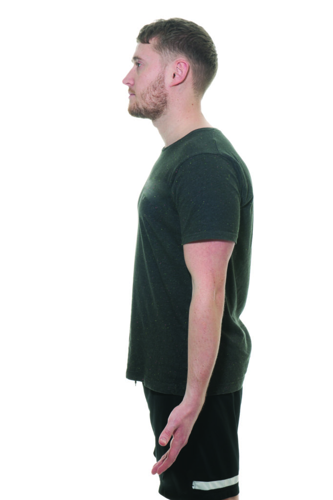 Photograph of a person with their arm relaxed by their side