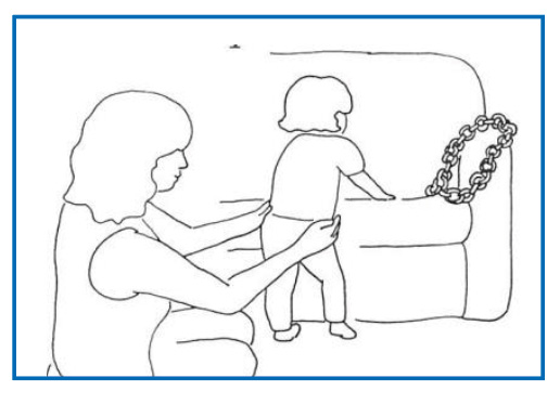 Image of child being supported by parent/carer to cruise/side step along furniture