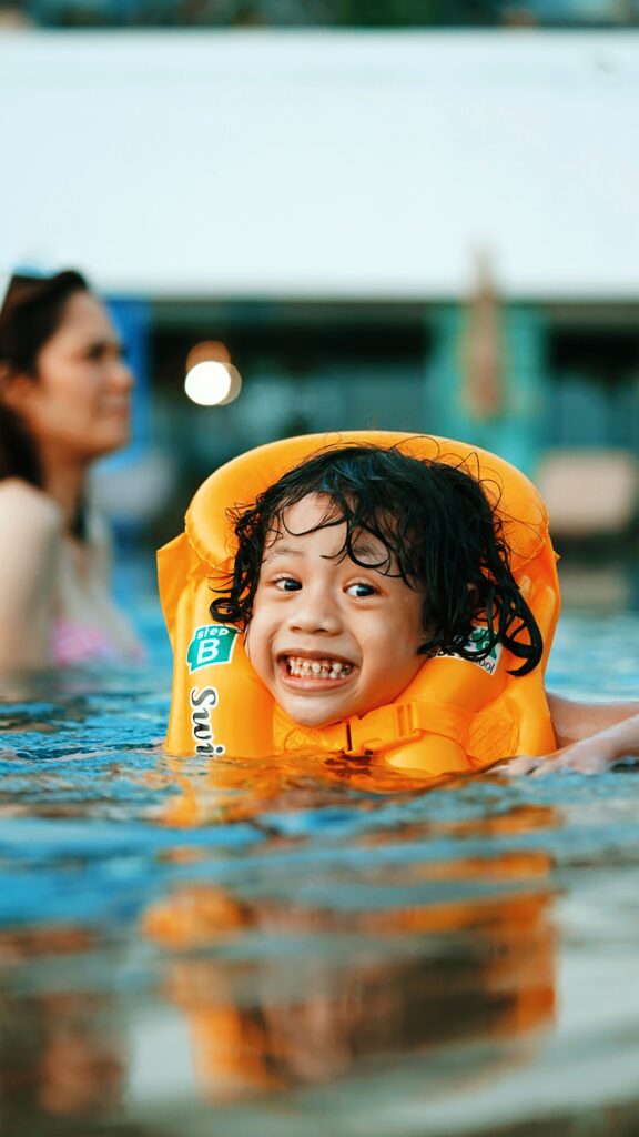 Image of child swimming in a pool