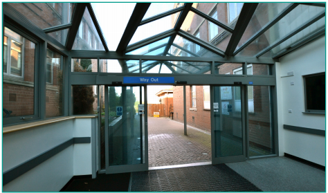 An image of the automatic doors to end up outside.