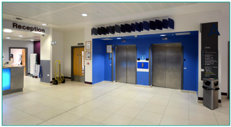 An image of the blue lifts on the right of reception.
