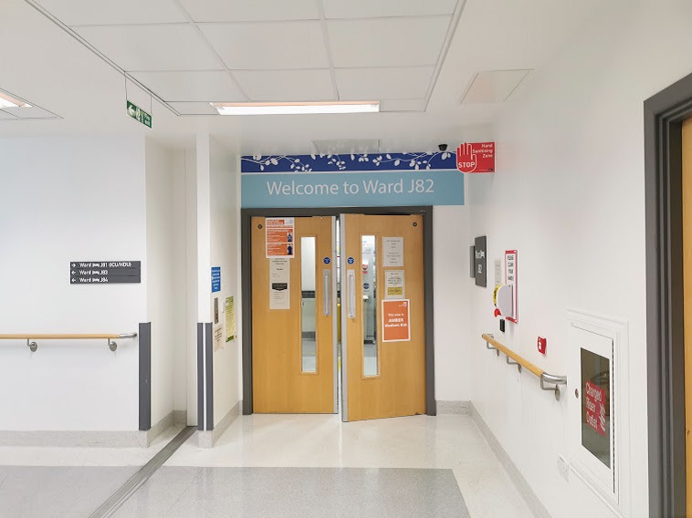 An image of double doors to the entrance to Ward J82.