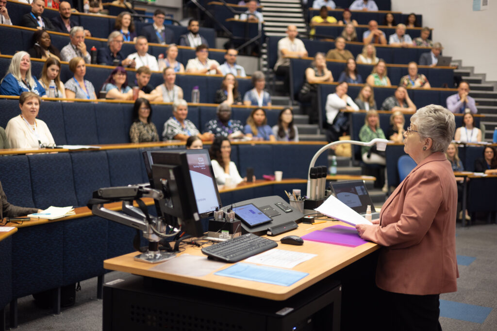 A photo of Sue Lees speaking to delegates at the Research and Innovation Conference.