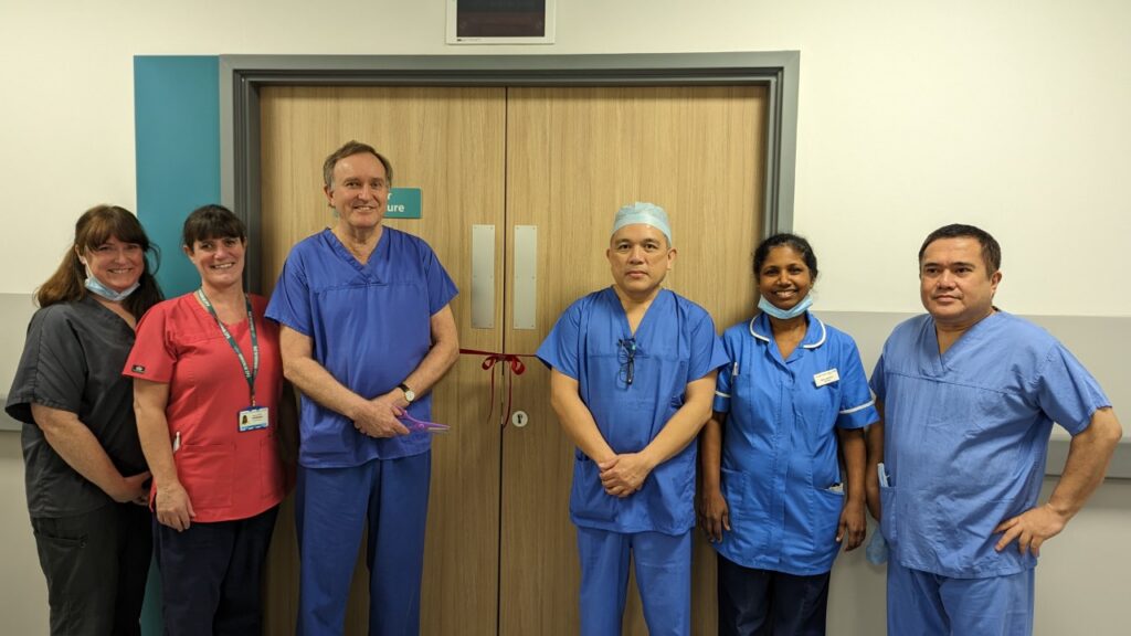 Members of the ophthalmology team opening the new refraction unit.