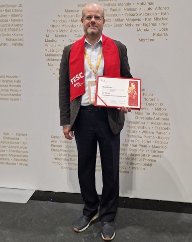 An image showing InnoMeds Team Member Dr Khatib holding the European Society of Cardiology Fellowship Certificate.