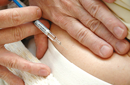 Photograph of someone having a heparin injection.