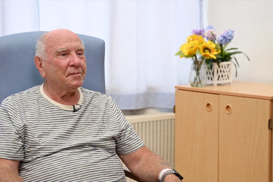 Colin Weeks, sitting in a chair in hospital
