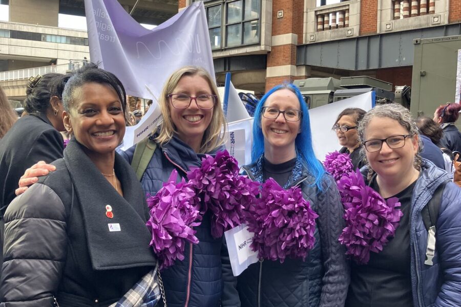 An image of Miss Shireen McKenzie, Dr Kerrie Davies and Dr Jane Freeman from left to right standing at the parade