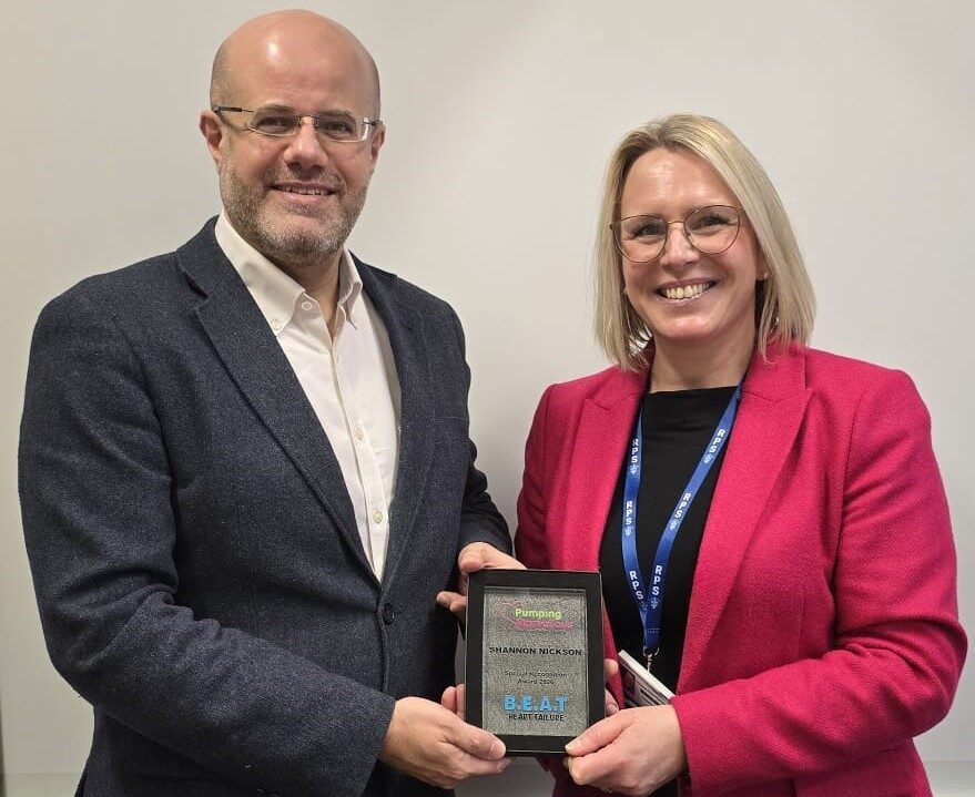 Shannon receiving her PMF award from colleague Rani Khatib