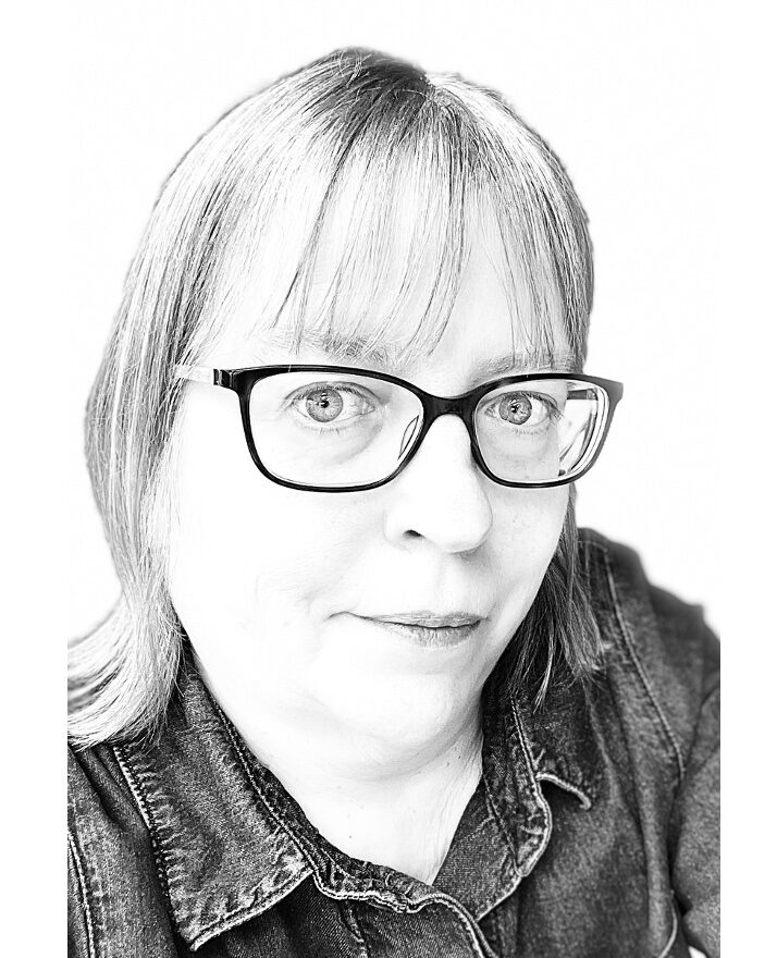 A photo in black and white of Dr Carole Burnett.