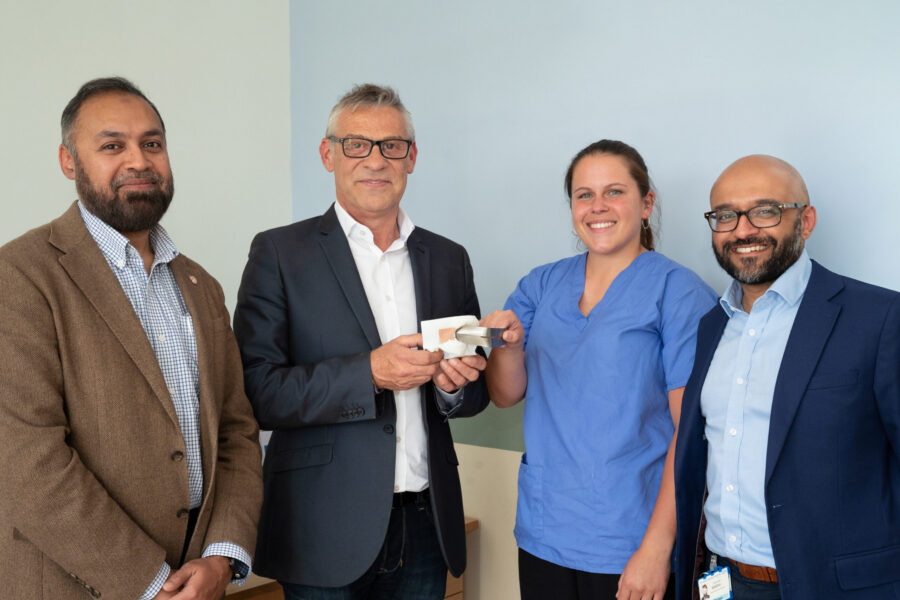 M20260508_008_Neurosurgery_Team_with_Patient_z6c_5224