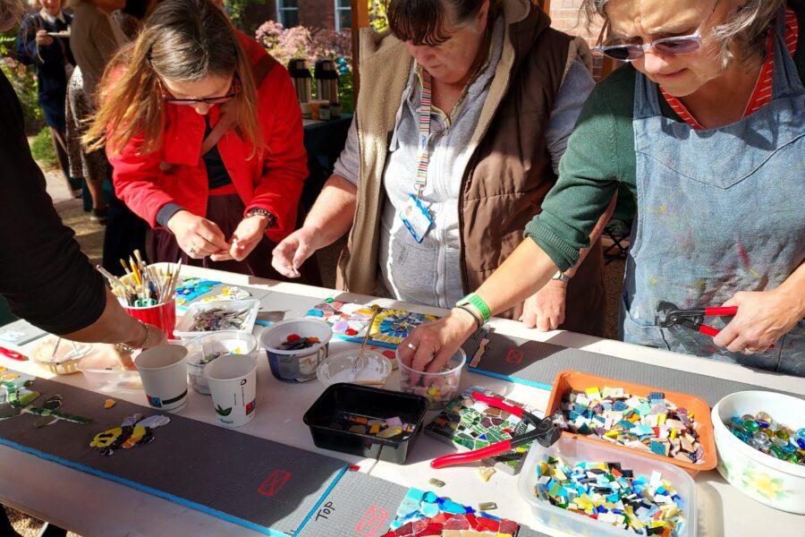 Visitors making mosaic art