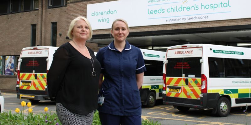 Two members of staff outside the Leeds Children's Hospital